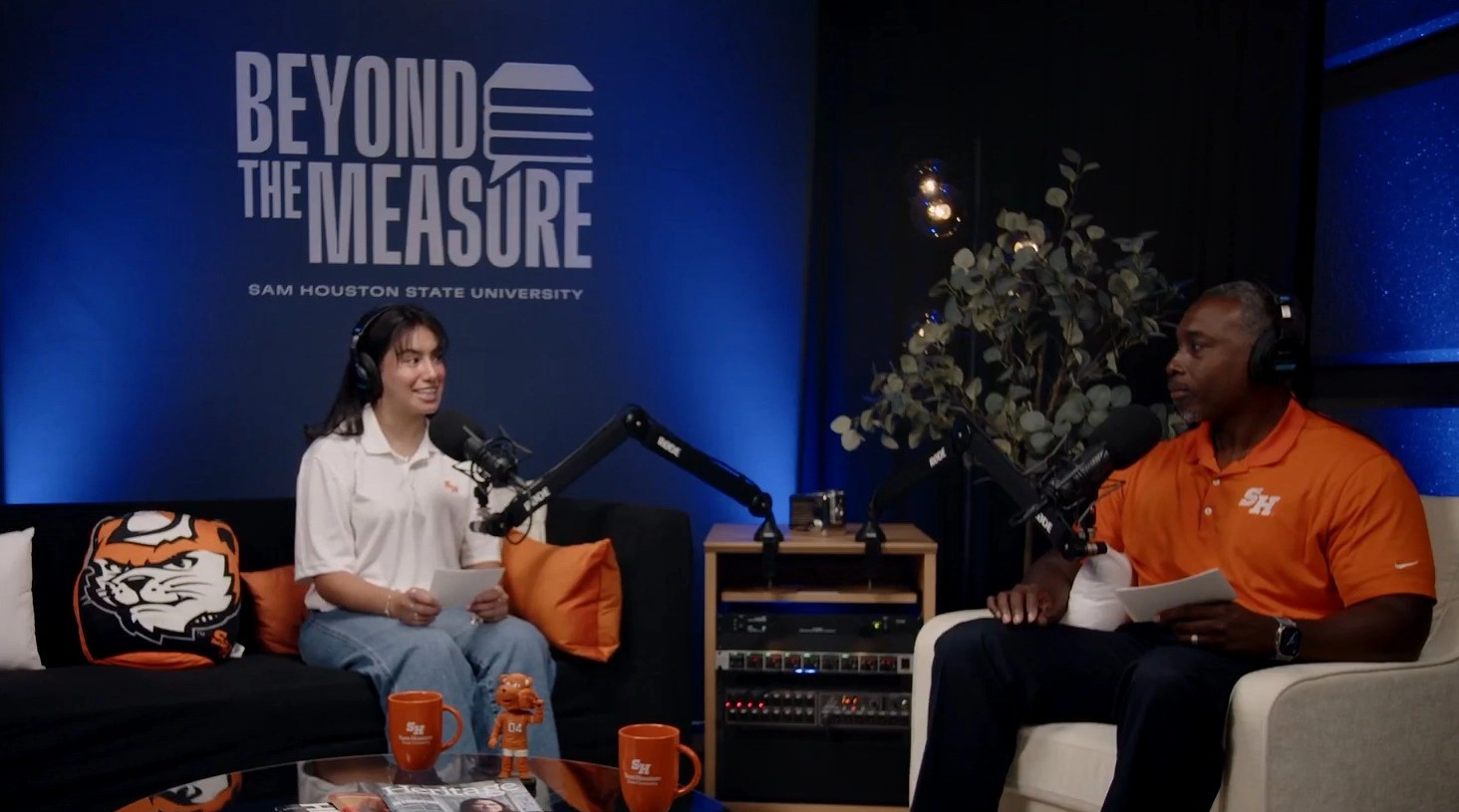 host and co host on the set of the podcast