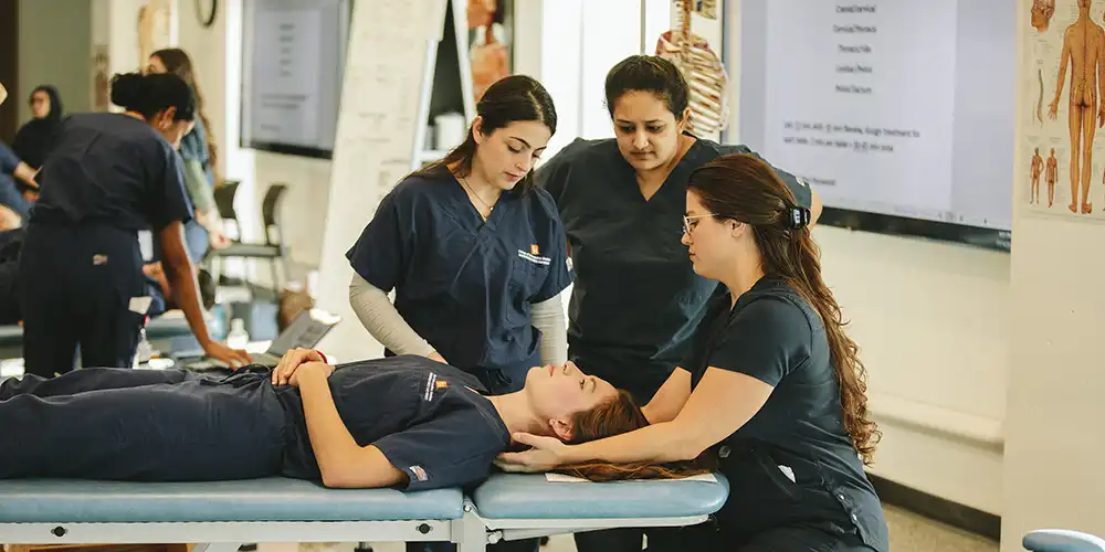 Nurses attending to student on stretcher