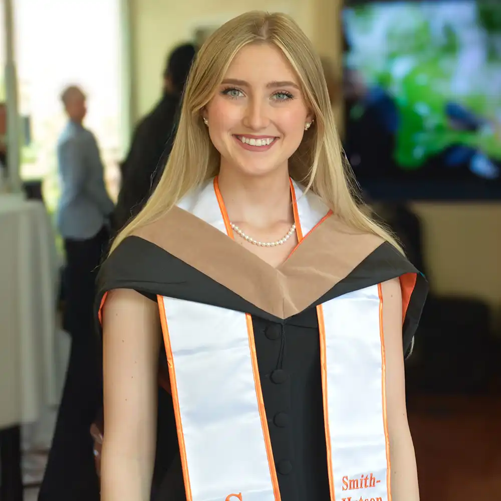 A photo of a Smith-Hutson scholar, a woman, at an event.