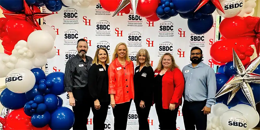 Members of the SBDC posing for a picture at an event.