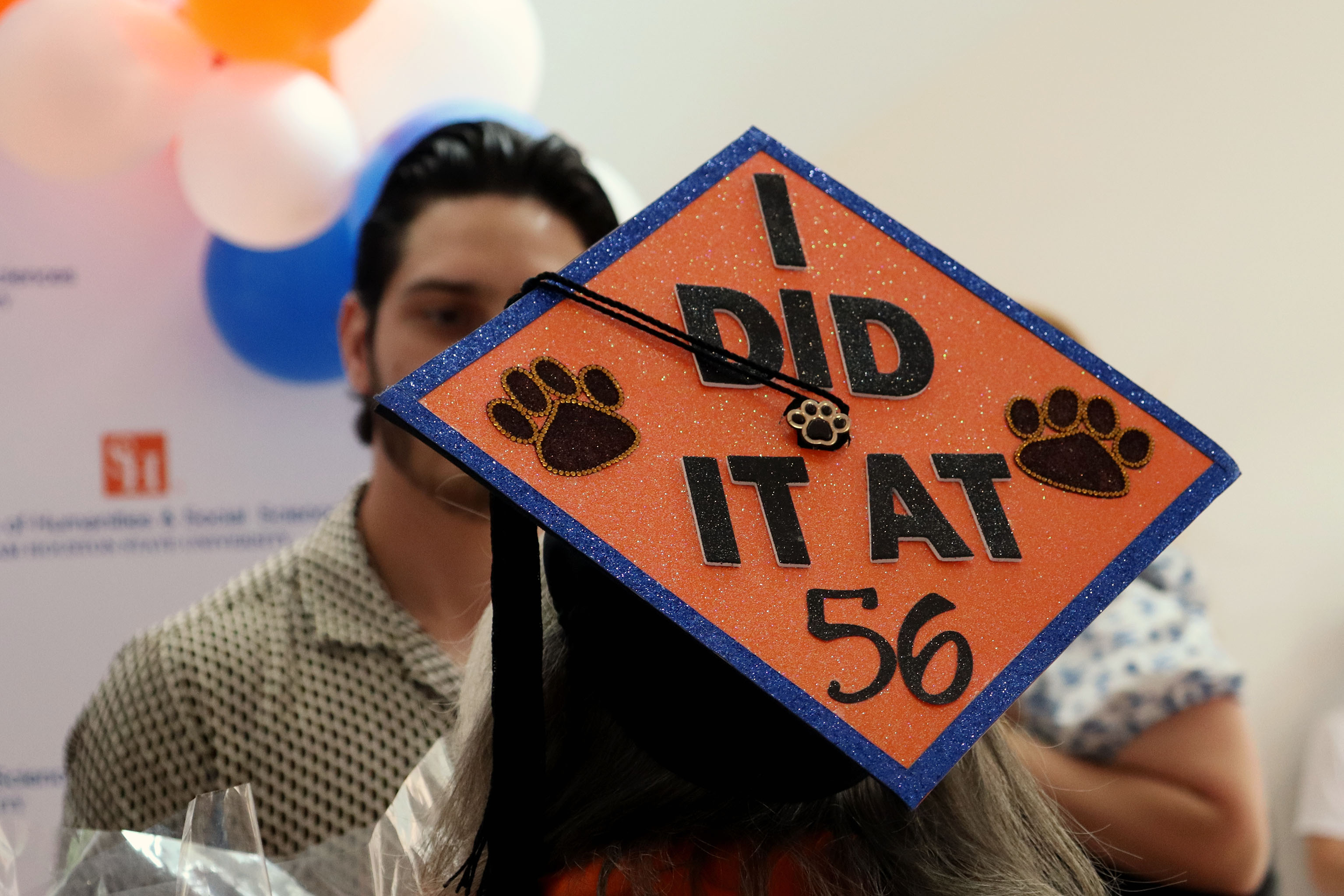 SHSU graduate decorated their graduation motor board to read,” I did it at 56”.