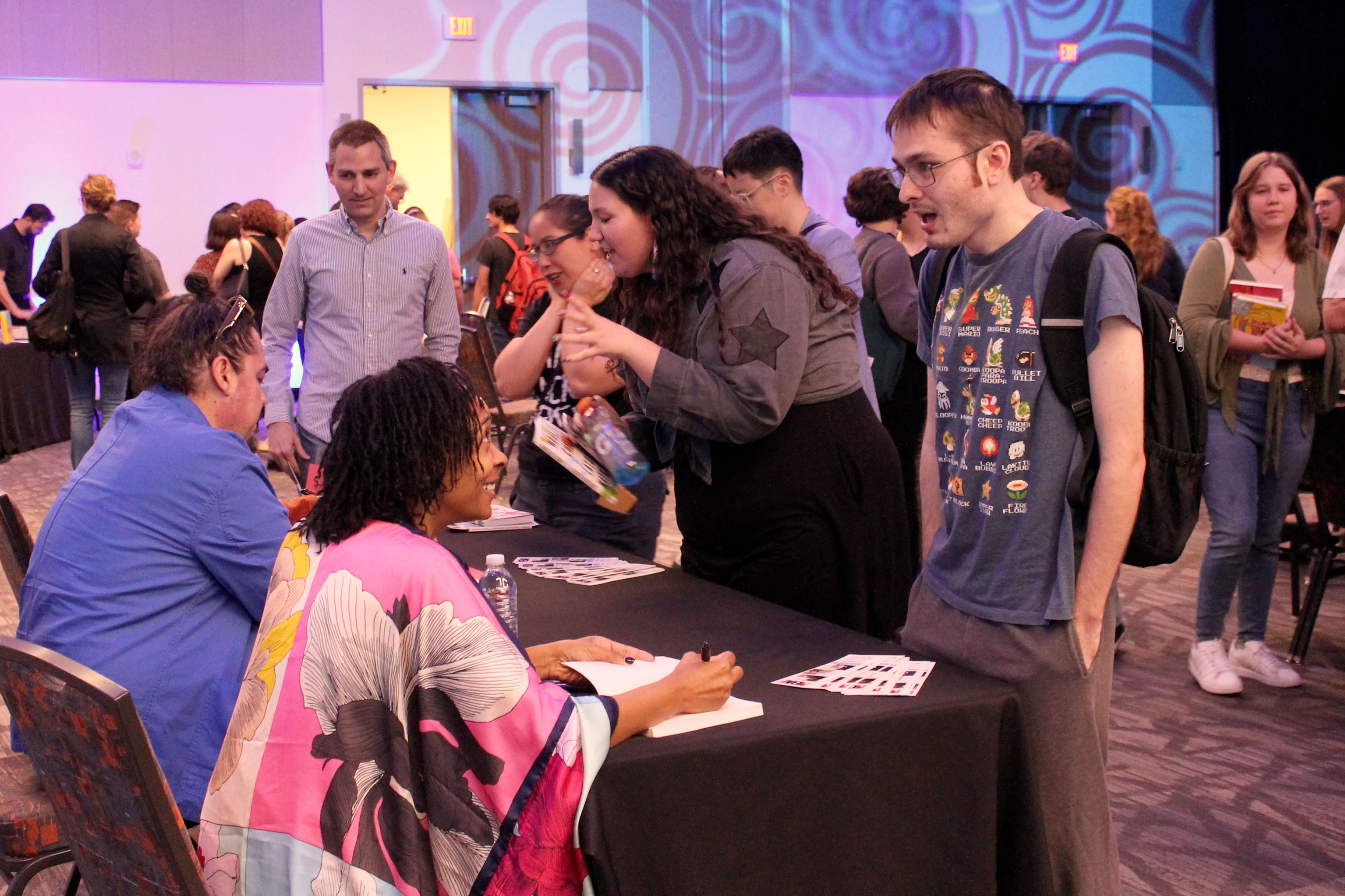 SHSU students and faculty speak with visiting authors on campus.