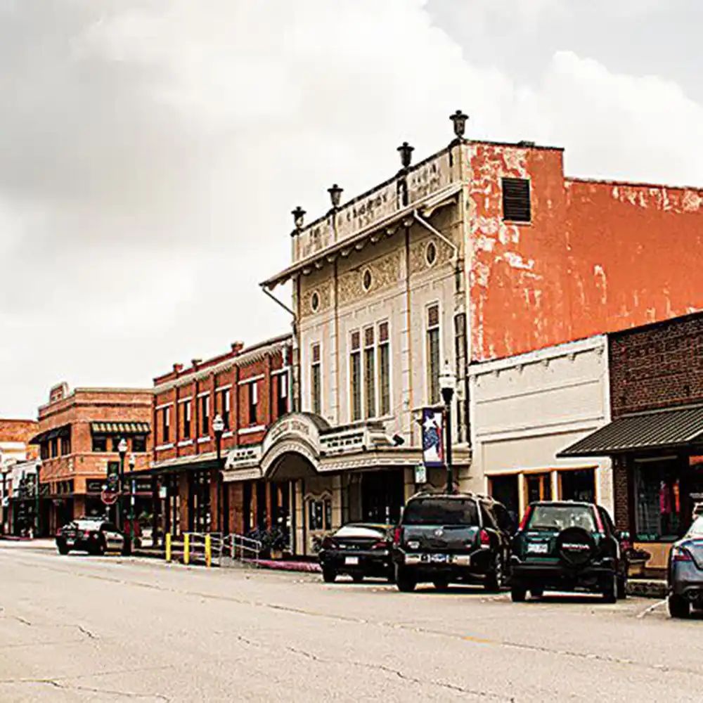 Downtown Conroe showing buildings and cars