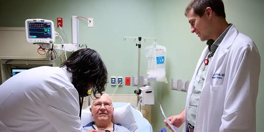 Residents with a patient at HMH family medicine residency