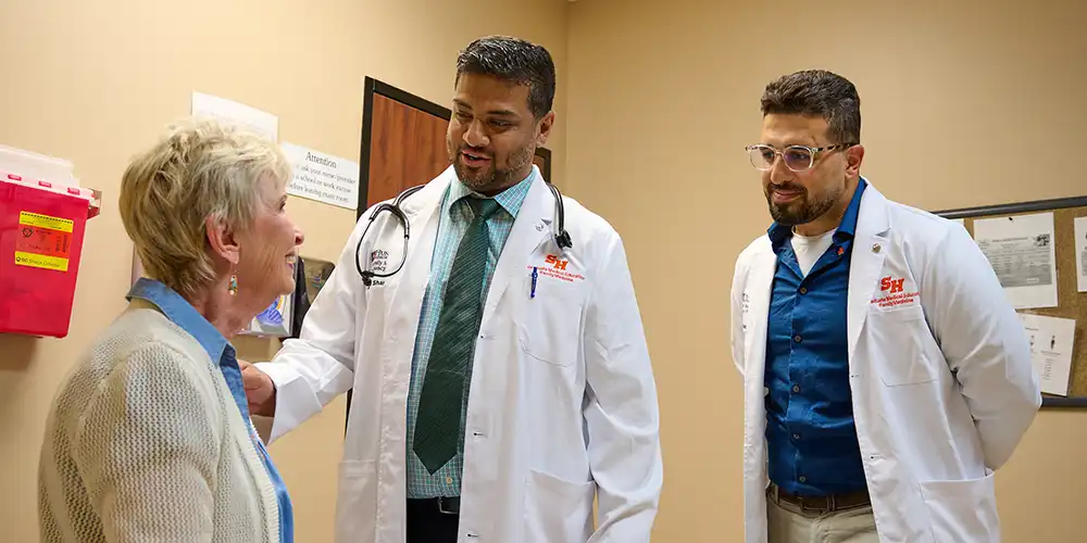 Family medicine residents with a patient