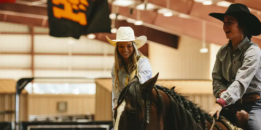Two members of the SHSU Rodeo Team at Gibbs Ranch