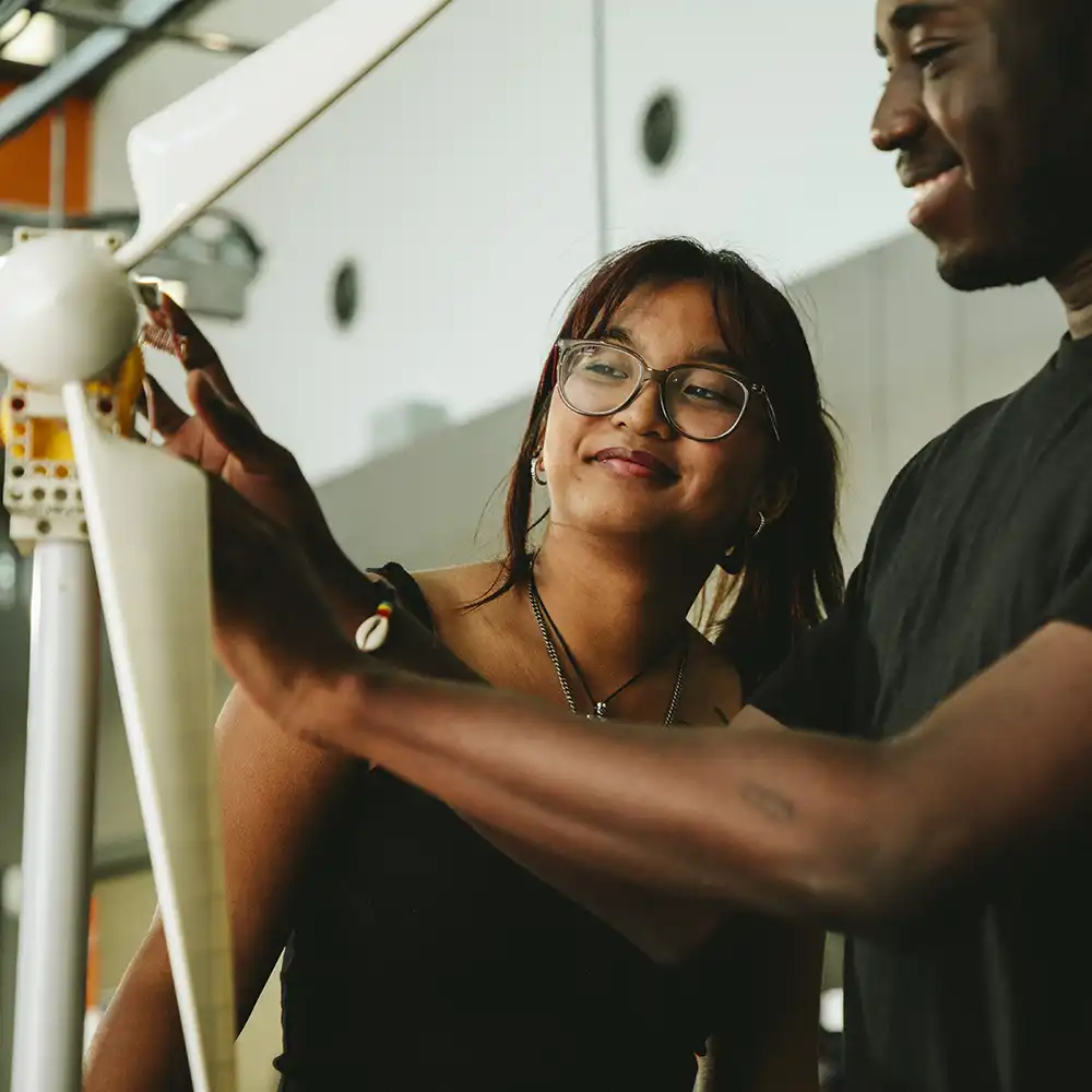SHSU Students working a mini turbine