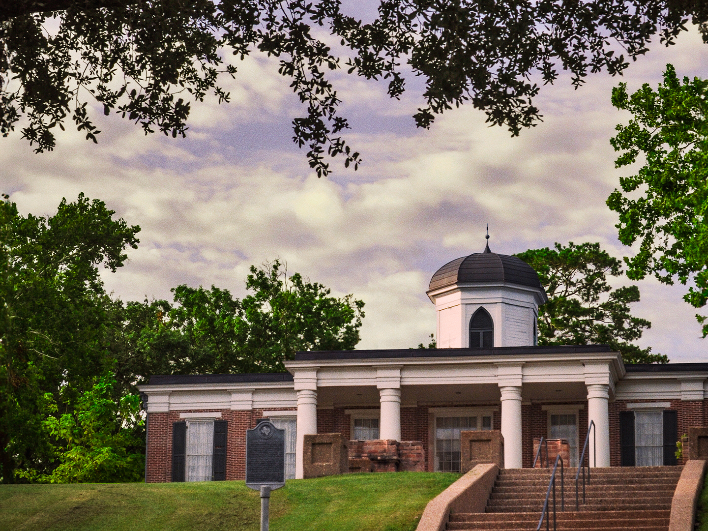 Austin Hall with a cloudy sky