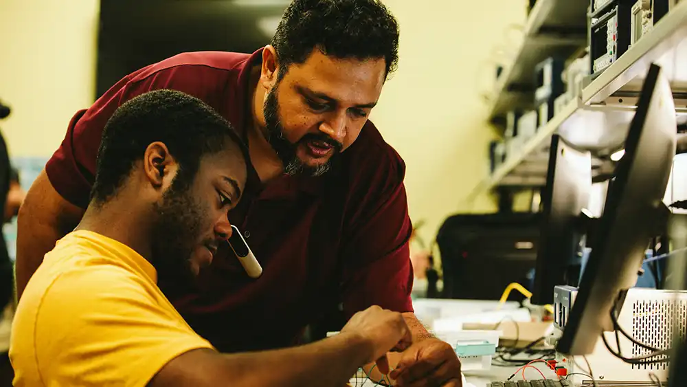 Professor helping student.
