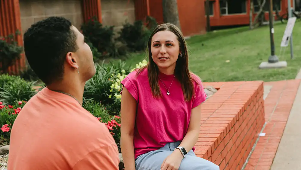 SHSU students engage in conversation on campus