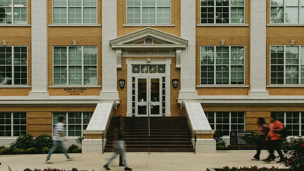SHSU students walking on campus.