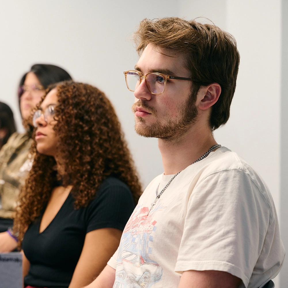 Students in classroom listening to speaker
