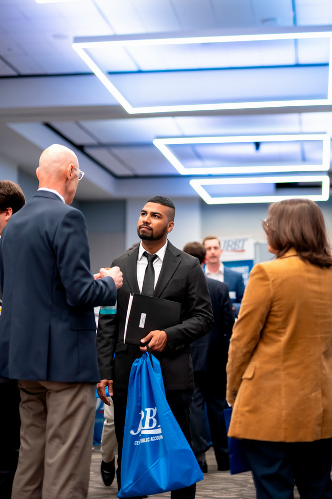 Accounting student listening to faculty