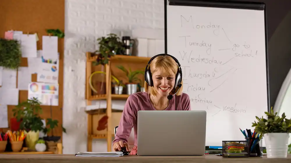 Teacher working online in her classroom. 