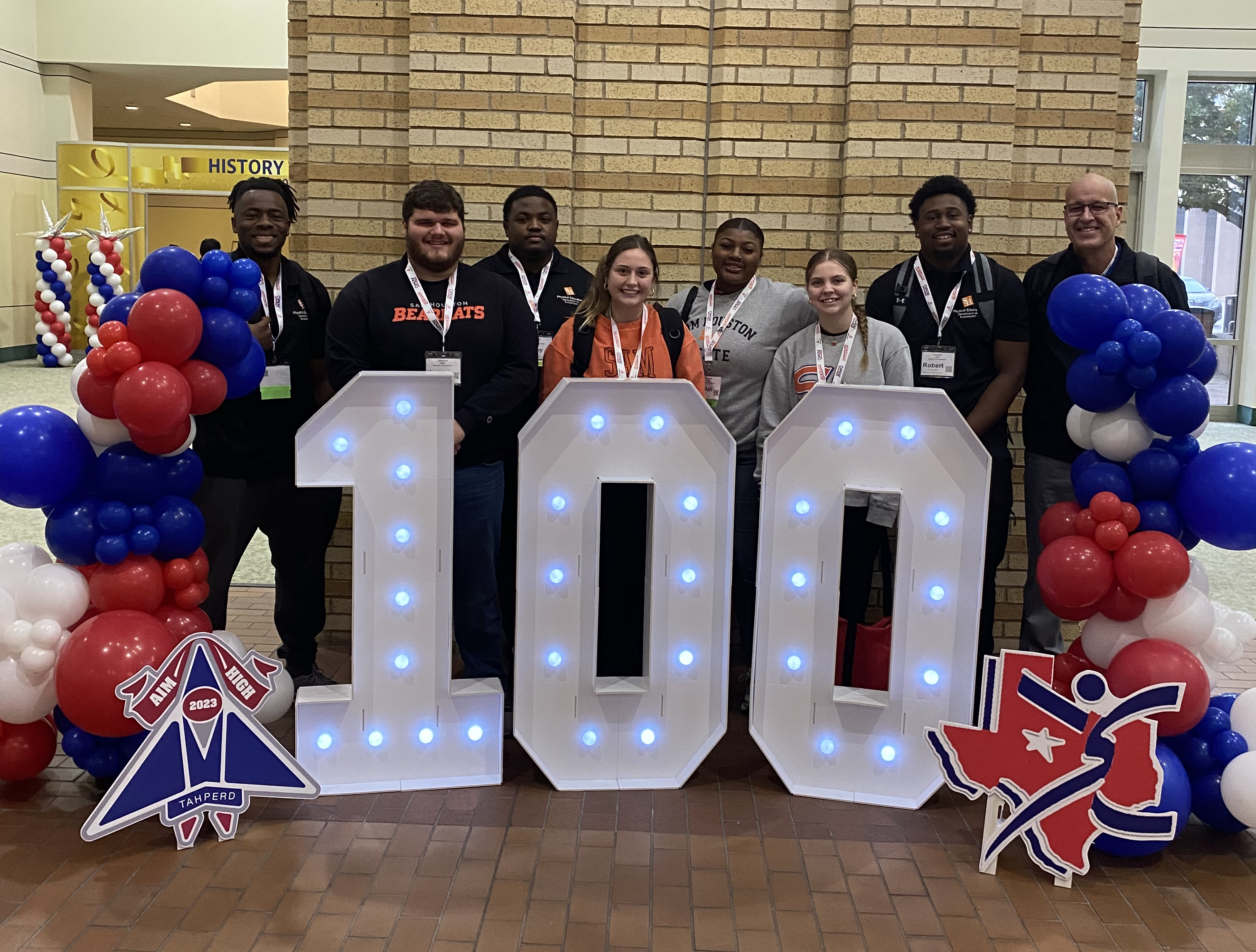 Man in suit talking to another man