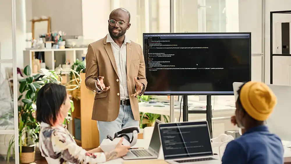 Man in suit talking to another man