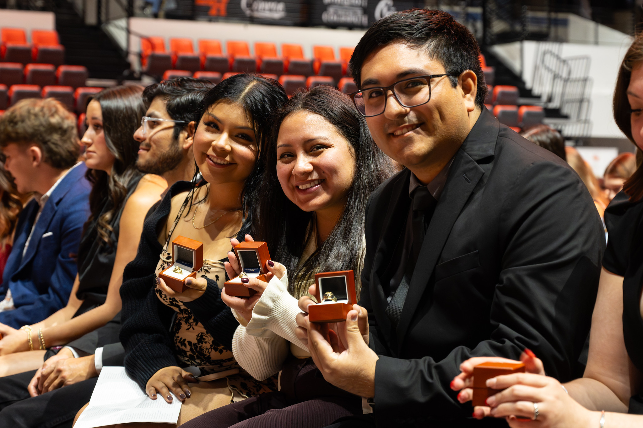 Students at the ring ceremony posing with rings