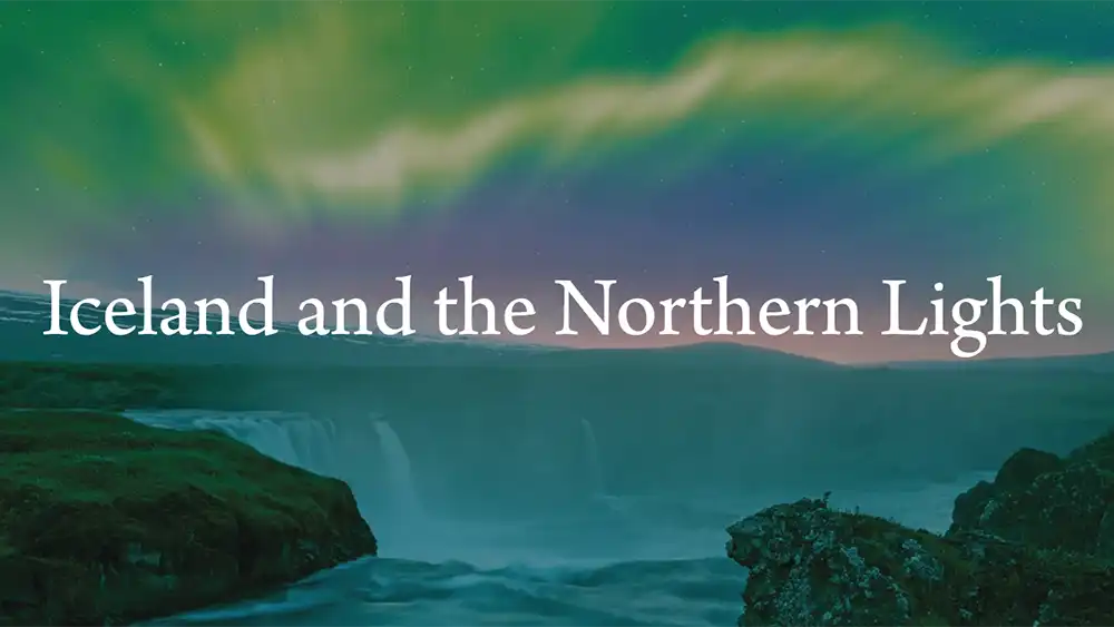 The Northern Lights seen over a waterfall in Iceland