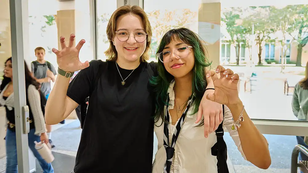 Two female students looking at the camera