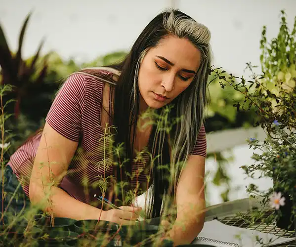 Female working in greenhouse