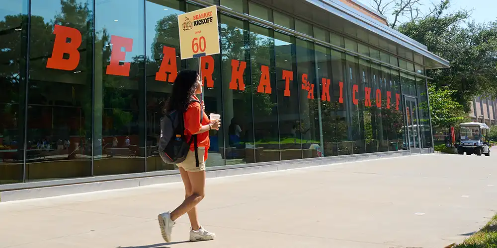 Five students 3 females two makes sitting at dry erase table in a room. ASC COBA tutoring is captioned on the pic