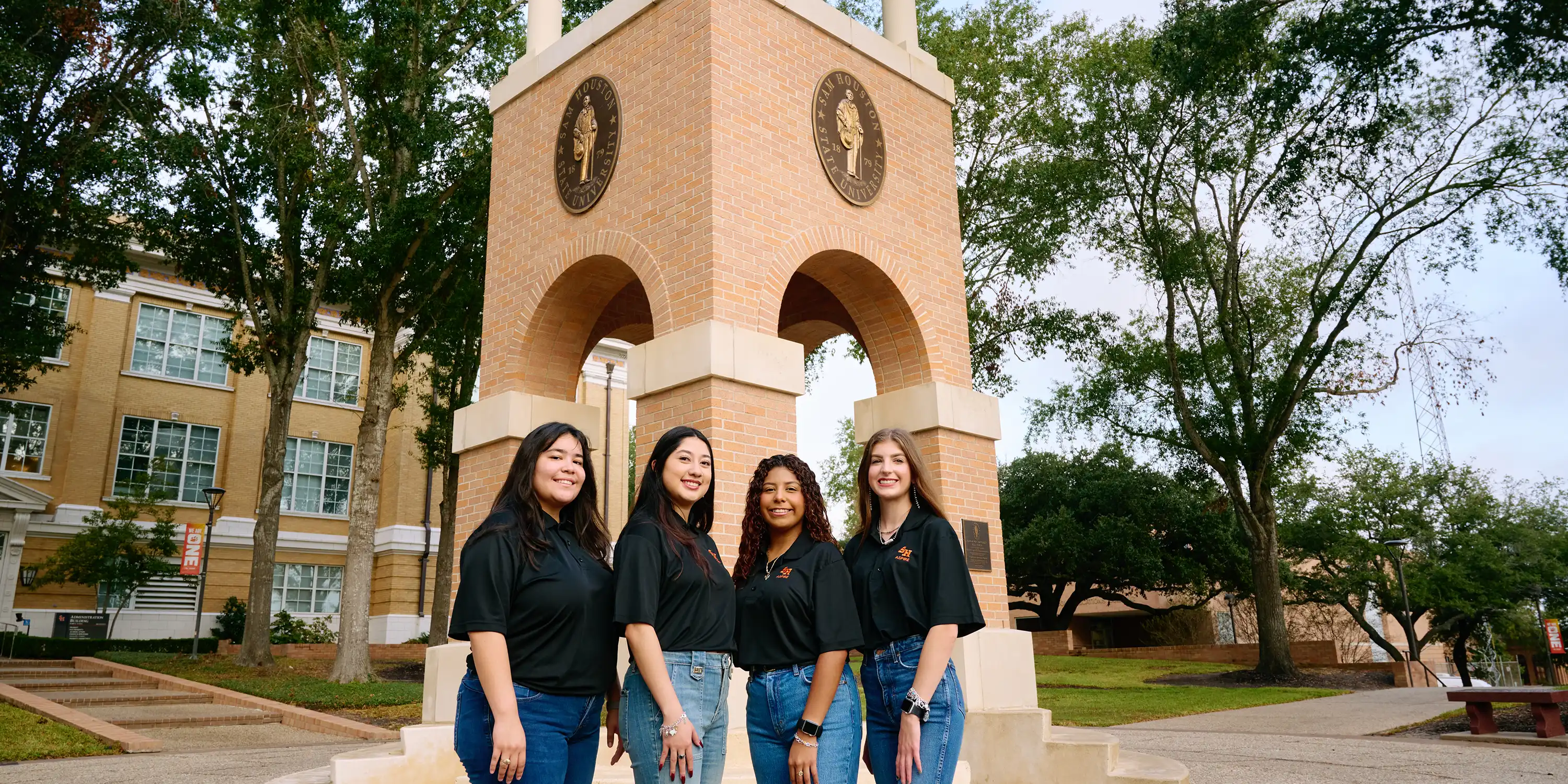 group of students at the bell tower