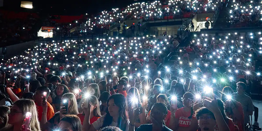 New Bearkats participate in the smartphone light show at New Student Convocation.