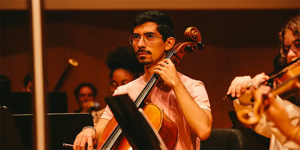 SHSU international alum from Colombia playing the cello.