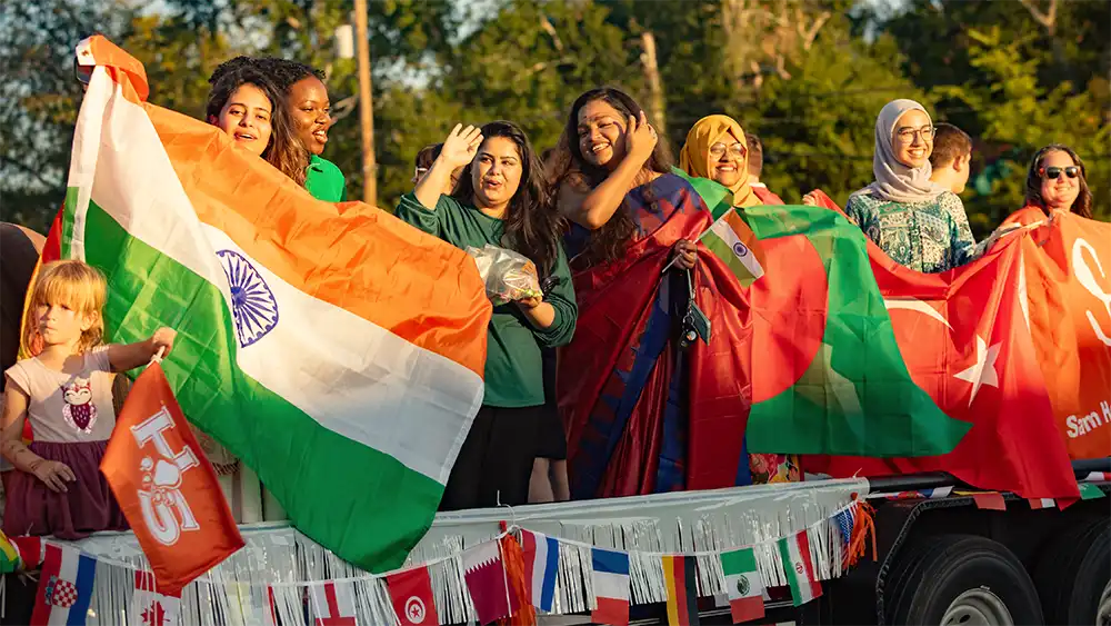 SHSU international student presenting during the 2024 International Community Welcome Dinner.