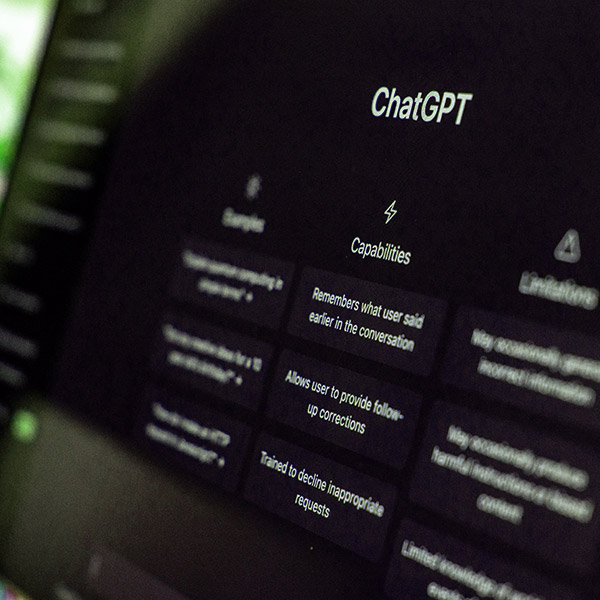 A close-up, slightly blurred shot of a computer monitor displaying the ChatGPT interface.