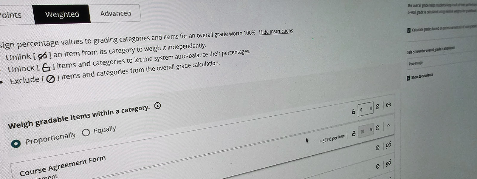 A close-up, angled shot of a computer screen showing a learning management system's grading interface.