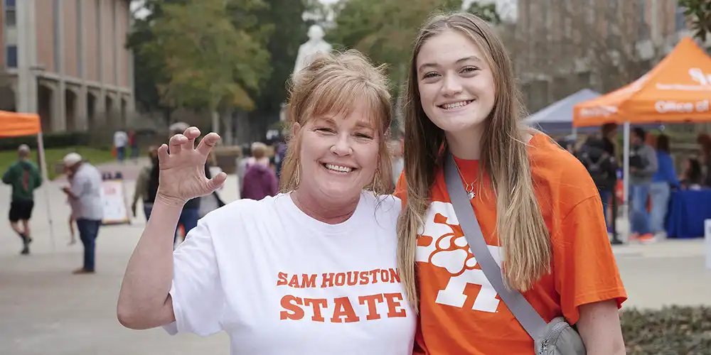 Mother and daughter smiling