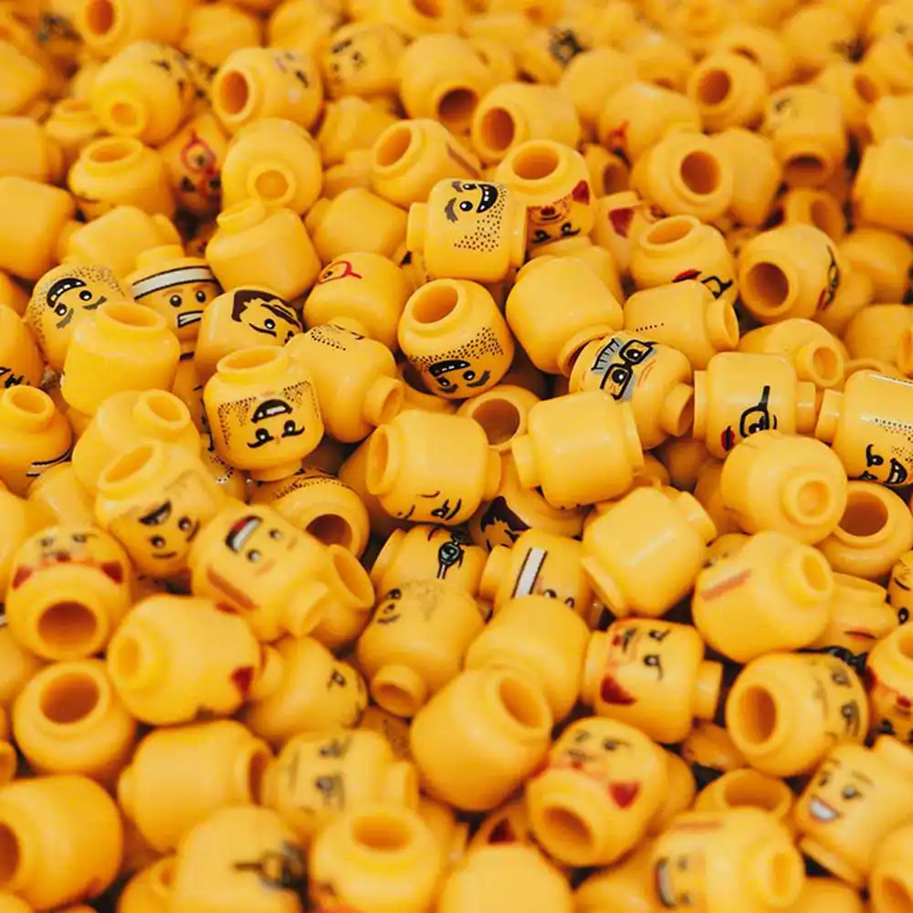 yellow plastic figurine heads