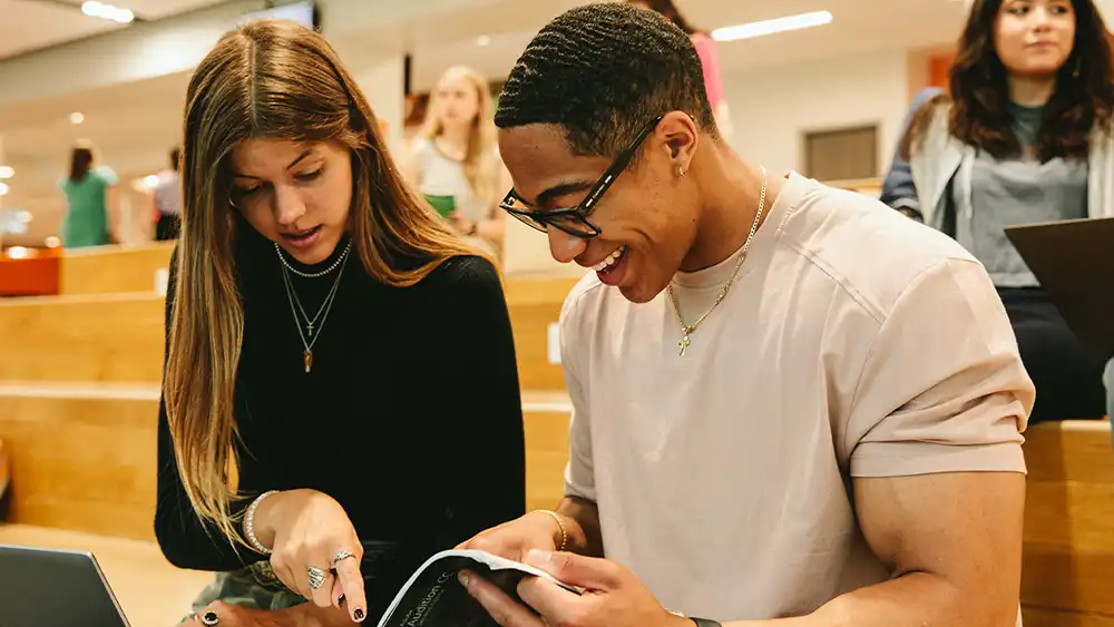 Two SHSU graduate students work together in a study group